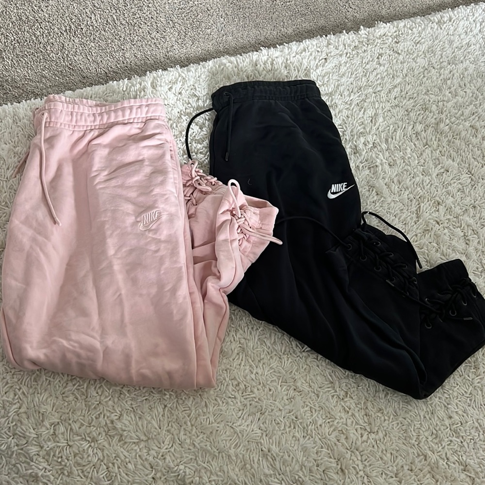 Set of black and pink Nike lace up joggers